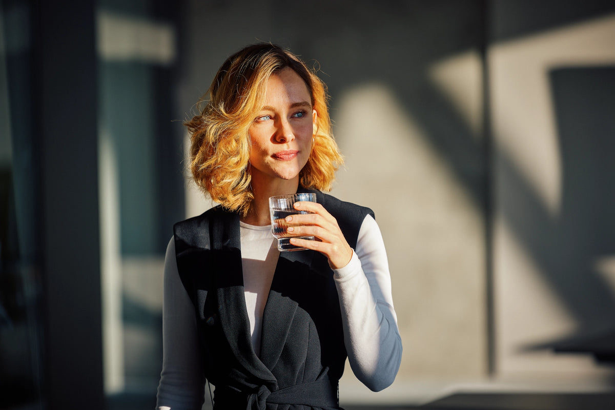 Woman holding a glass of water